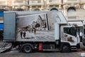 A box truck with vintage postcard decoration