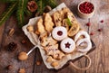Box with variety of Christmas cookies: linzer cookies with raspberry jam, stars, Christmas trees, Biscotti, cantucci, horseshoes Royalty Free Stock Photo