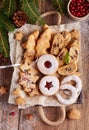 Box with variety of Christmas cookies: linzer cookies with raspberry jam, stars, Christmas trees, Biscotti, cantucci, horseshoes Royalty Free Stock Photo