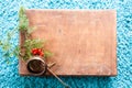 Box with wooden texture and fir tree on fluffy blue carpet background. Top view copy space Royalty Free Stock Photo