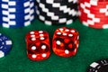 A boxcar sixes roll on a green felt craps table with stacks of Red, Black and Blue betting chips in the background Royalty Free Stock Photo