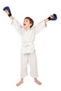 Boxer boy in white dress and blue boxing gloves Royalty Free Stock Photo