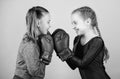 Boxer children in boxing gloves. Girls cute boxers on blue background. Friendship as battle and competition. Pass boxing