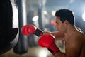 Boxer doing punch training in gym Royalty Free Stock Photo