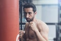 Boxer exercising with a punching bag at the gym Royalty Free Stock Photo