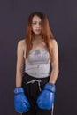 Boxer girl boxing gloves worth tired and sweaty Royalty Free Stock Photo