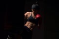 Boxer girl wearing red gloves and a bandana Royalty Free Stock Photo