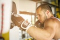 Boxer hitting the glove of his sparring partner.