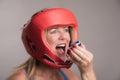 Boxer inserting a gum shield into the mouth Royalty Free Stock Photo