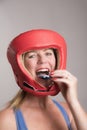 Boxer inserting a gum shield into the mouth Royalty Free Stock Photo