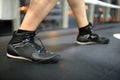Boxer legs dressed in boxing shoes on a ring closeup Royalty Free Stock Photo