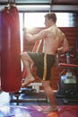 Boxer practicing kickboxing Royalty Free Stock Photo