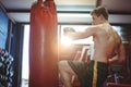 Boxer practicing kickboxing Royalty Free Stock Photo