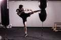 Boxer With Punch Bag In Action - A Man With A Tattoo In Red Boxing Gloves - Boxing Royalty Free Stock Photo