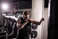 Boxer With Punch Bag In Action - A Man With A Tattoo In Red Boxing Gloves - Boxing Royalty Free Stock Photo