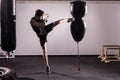 Boxer With Punch Bag In Action - A Man With A Tattoo In Red Boxing Gloves - Boxing Royalty Free Stock Photo