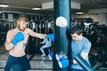 Boxer with punching bag in gym Royalty Free Stock Photo