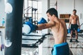 Boxer with punching bag in gym Royalty Free Stock Photo