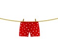 Boxer shorts with white hearts hanging on rope