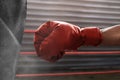 Boxer wearing red boxing glove