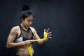 Boxer woman wearing yellow strap on wrist Royalty Free Stock Photo