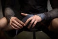 Boxer wrapping hands with boxing handwraps before training