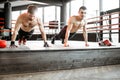 Boxers doing push-ups at the gym Royalty Free Stock Photo