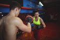 Boxers using focus mitts during training