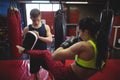 Boxers using focus mitts during training