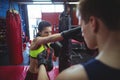 Boxers using focus mitts during training