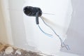 Boxes and cables of new electrical installation. DIY, house indoor improvements room construction Royalty Free Stock Photo