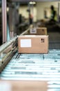 Parcel boxes on conveyer belt.