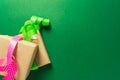 Boxes in craft paper with ribbons over green background Royalty Free Stock Photo