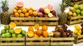 Boxes with different kinds of fresh fruits displayed in wooden crates at the grocery store. Royalty Free Stock Photo