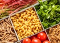 Boxes with different uncooked pasta and products, closeup