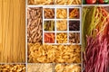 Boxes with different uncooked pasta, top view