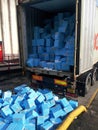 Boxes of fish spilling out of refrigerated shipping container