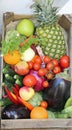 boxes of fresh vegetables and fruits on sale at market