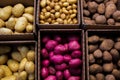 Boxes full of different types of potatoes