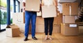 Boxes full of possessions, hearts full of priceless memories. Shot of an unrecognisable mature couple carrying boxes on Royalty Free Stock Photo