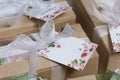 Boxes with homemade marshmallows. Tied with tape. The branded tag of the entrepreneur is visible. Zephyr flowers. Roses from Royalty Free Stock Photo