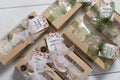 Boxes with homemade marshmallows. Tied with tape. The branded tag of the entrepreneur is visible. Zephyr flowers. Roses from Royalty Free Stock Photo