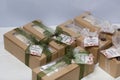 Boxes with homemade marshmallows. Tied with tape. The branded tag of the entrepreneur is visible. Zephyr flowers. Roses from Royalty Free Stock Photo