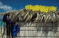 Boxes and life vests on top of a straw hut Royalty Free Stock Photo