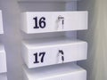 Boxes in the post office. Mini safe with key. The concept of secure storage. Box numbers 16 and 17 Royalty Free Stock Photo