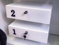 Boxes in the post office. Mini safe with key. The concept of secure storage. Box numbers 2 and 1 Royalty Free Stock Photo