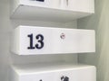 Boxes in the post office. Mini safe with key. The concept of secure storage. Box numbers 13 Royalty Free Stock Photo