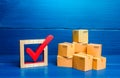 Boxes and red check mark. Verification and standardization of goods and imported products. Quality control. Available in stock