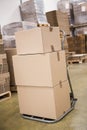 Boxes on trolley in warehouse Royalty Free Stock Photo