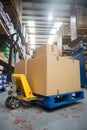 Boxes on trolley in warehouse Royalty Free Stock Photo